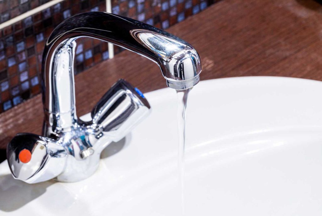 Running water from a modern bathroom faucet