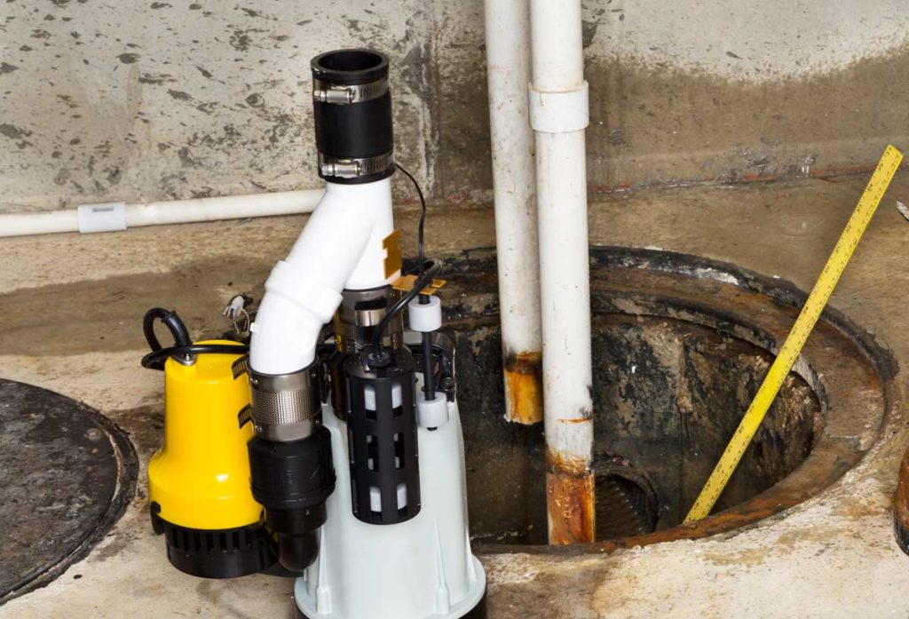 Sump pump installation in a basement pit