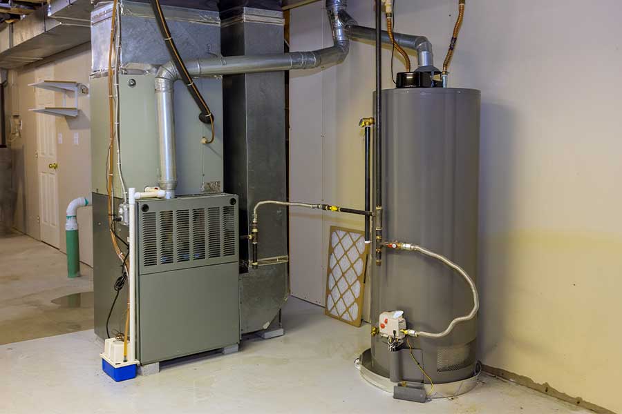 Basement HVAC system with a water heater and ductwork