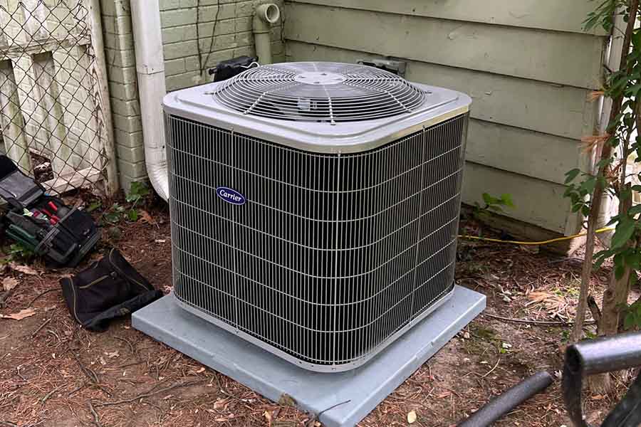 A Carrier AC unit set up outside a home