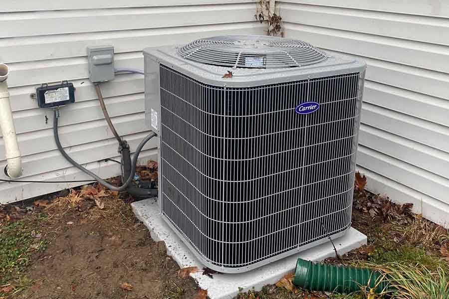 A Carrier AC unit installed outside a home
