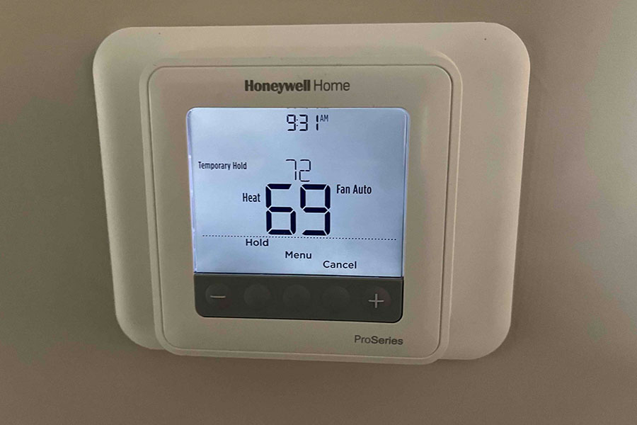 Digital thermostat set to 69 degrees Fahrenheit
