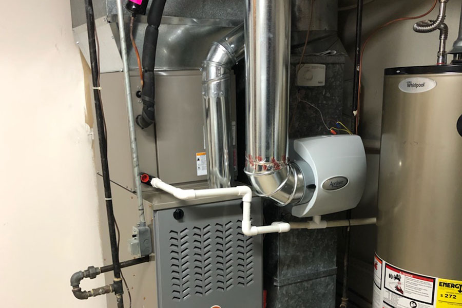 HVAC system with a furnace, humidifier, and water heater